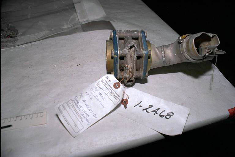 Auxiliary tank fill/isolation valve housing