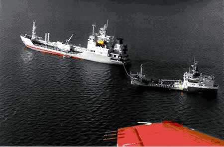 Photo 1 - MV Mokami aground - cargo being transferred to the Sybil W